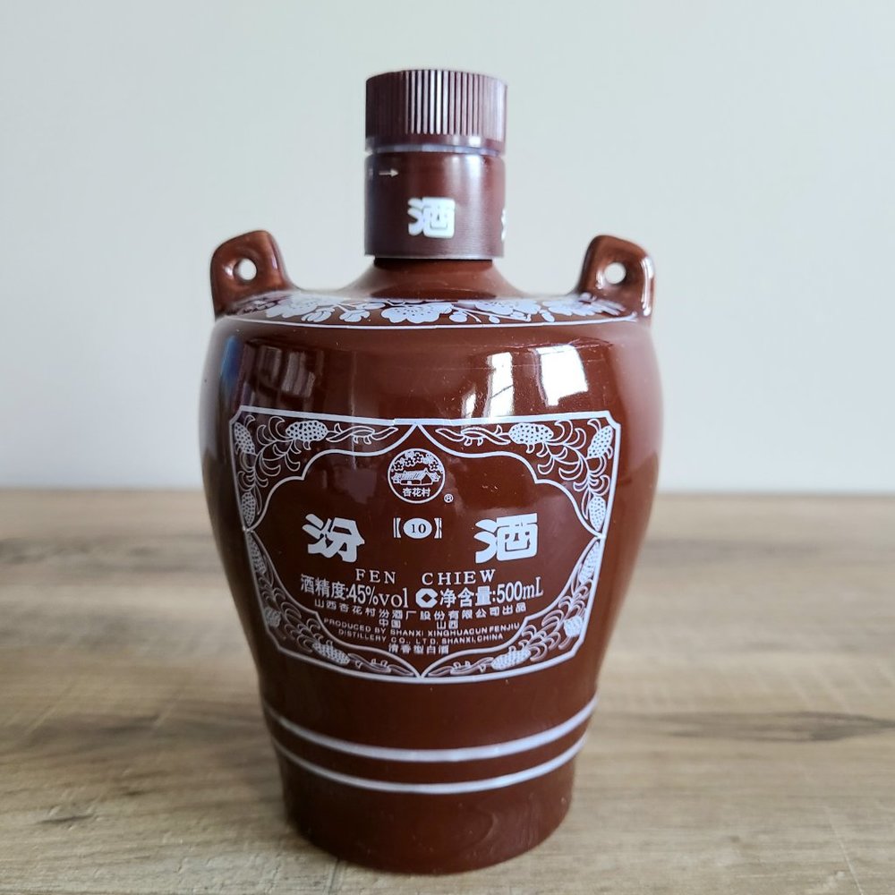 Ceramic empty liqueur bottle with handles. Fen Chiew.